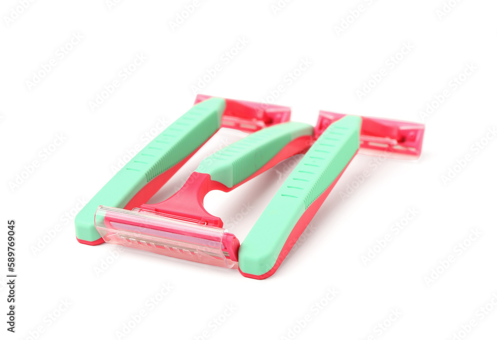 Colorful safety razors on white background