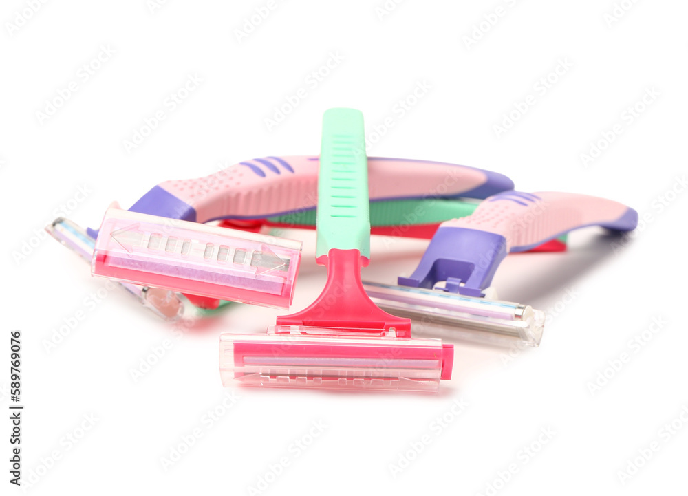 Heap of safety razors on white background