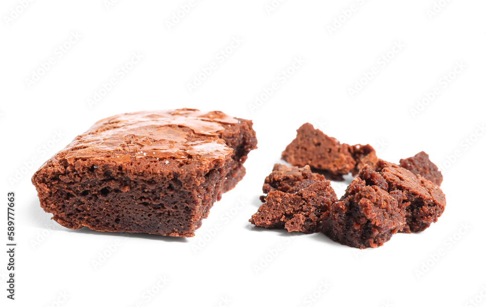 Pieces of tasty chocolate brownie isolated on white background