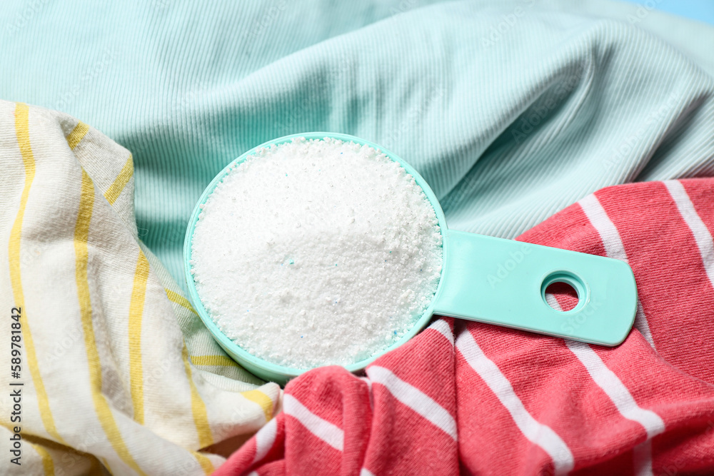 Laundry detergent on dirty clothes, closeup