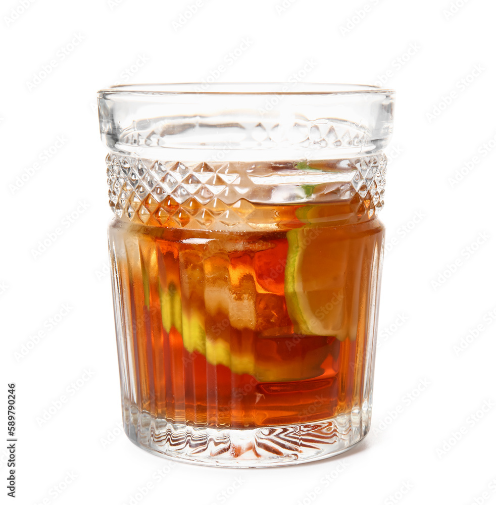 Glass of cold rum with lime on white background