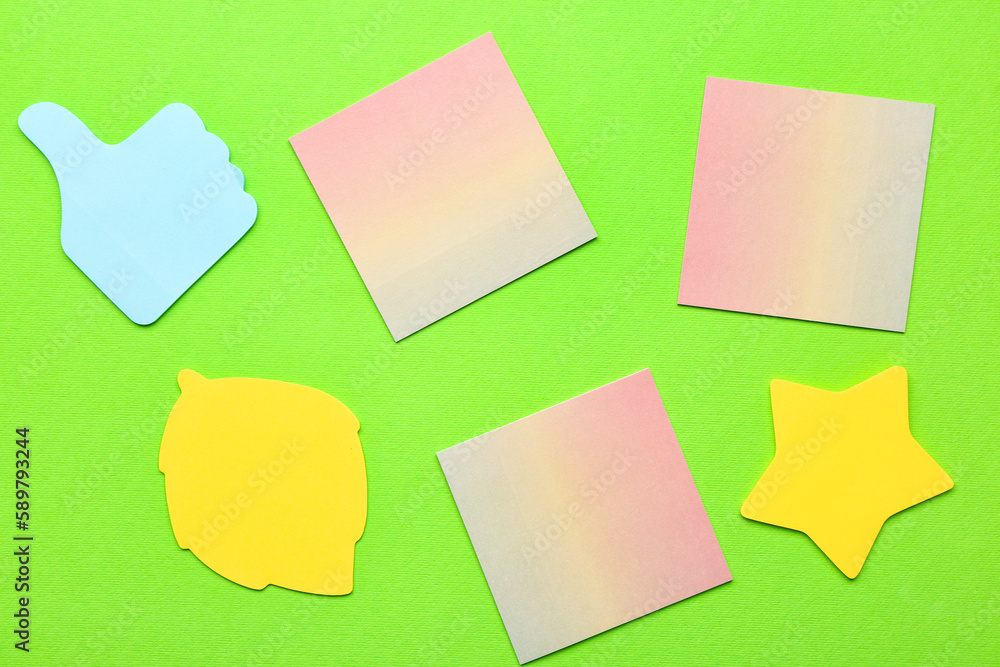 Colorful sticky notes on green background