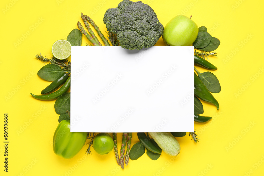 Composition with different fresh vegetables, fruits and blank paper sheet on yellow background