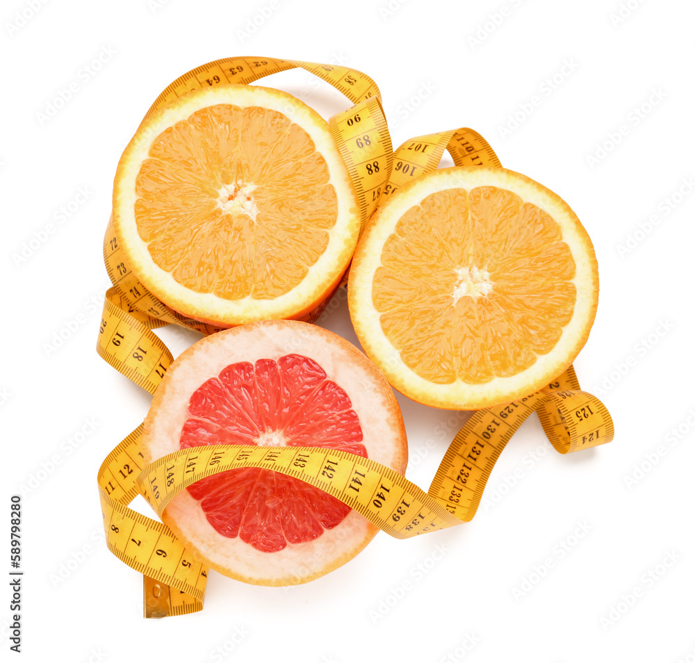 Cut oranges and green measuring tape on white background. Diet concept