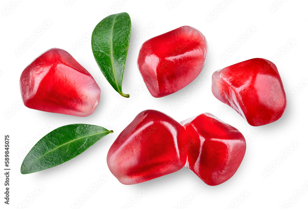 Pomegranate seeds isolated. Pomegranate grains with leaves flat lay on white background. Pomegranate