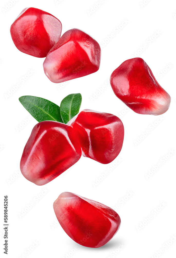 Pomegranate seeds isolated. Pomegranate grains with leaves flying. Pomegranate seed on white backgro