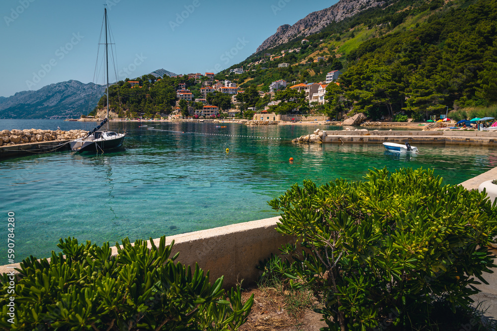 Beautiful mediterranean small harbor and moored boats, Brela, Dalmatia, Croatia