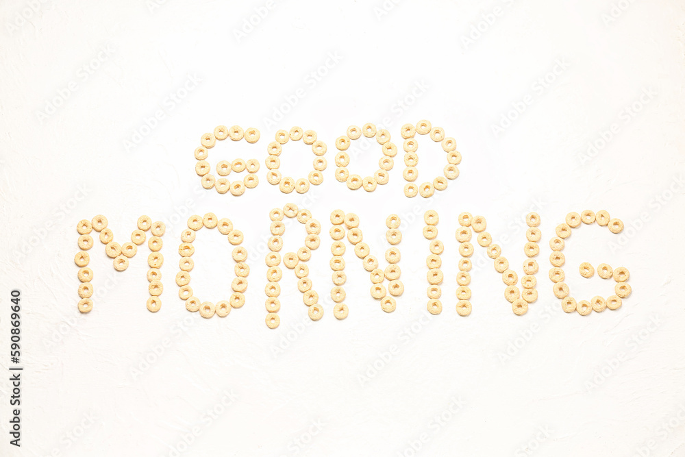 Text GOOD MORNING made of cereal rings on light background