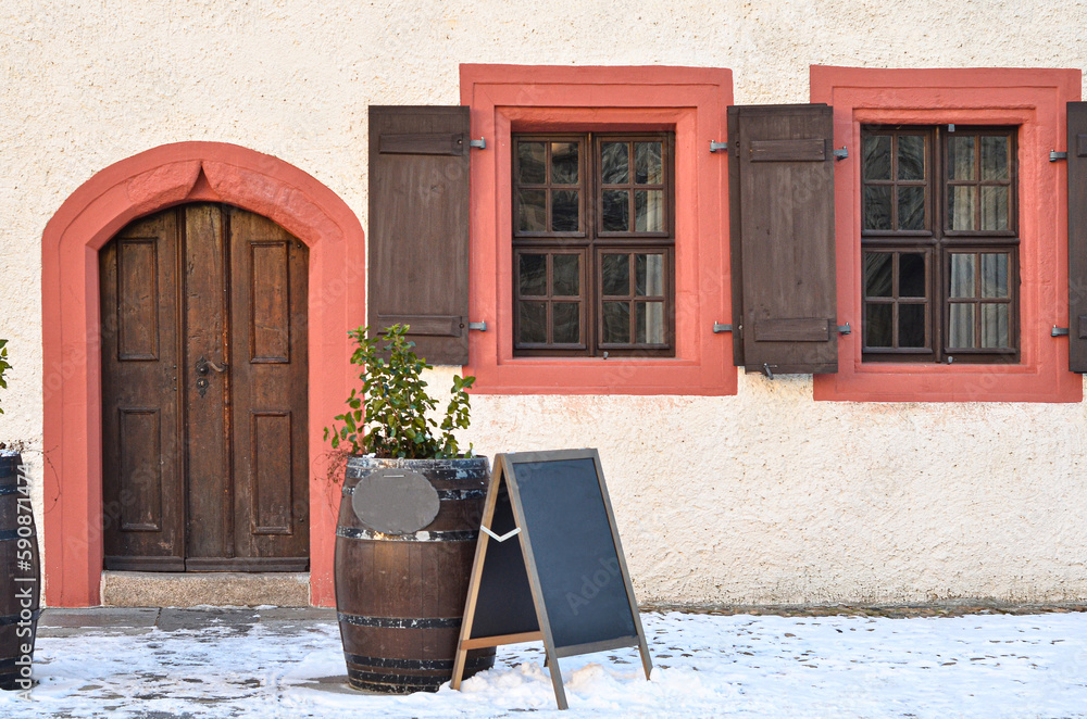 View of beautiful building with wooden door and windows