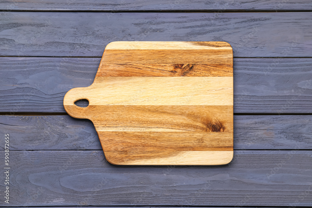 New kitchen board on color wooden background