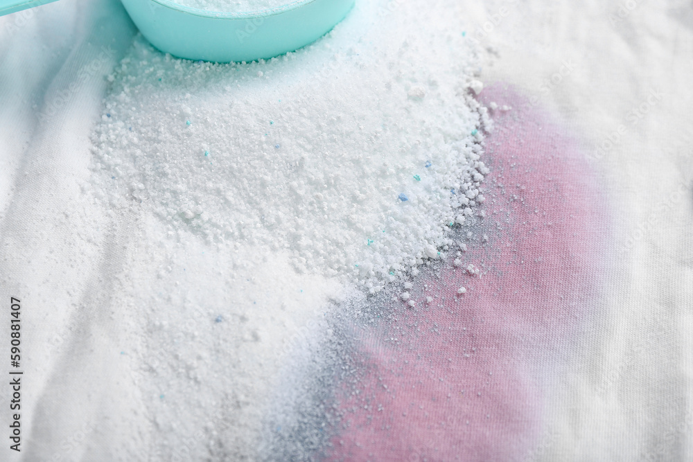 Laundry detergent on stained clothes, closeup