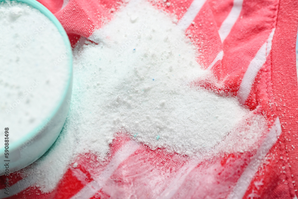 Laundry detergent on stained clothes, closeup