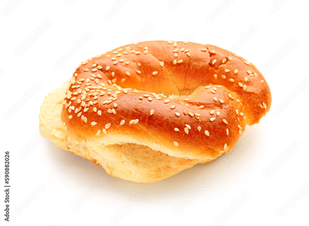 Halves of tasty bagel with sesame seeds on white background