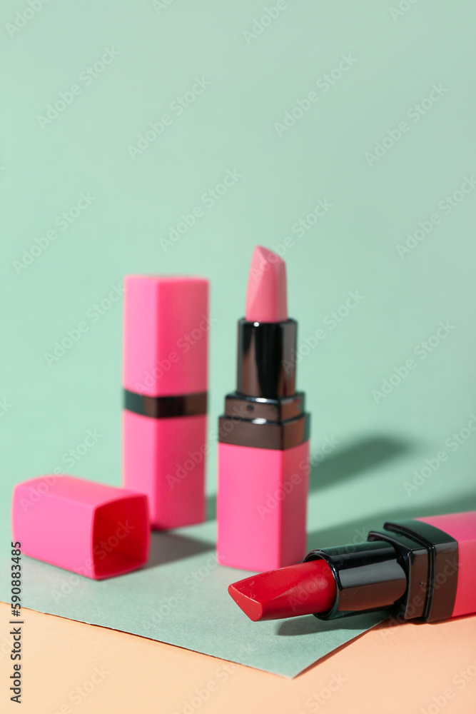 Bright lipsticks on color background