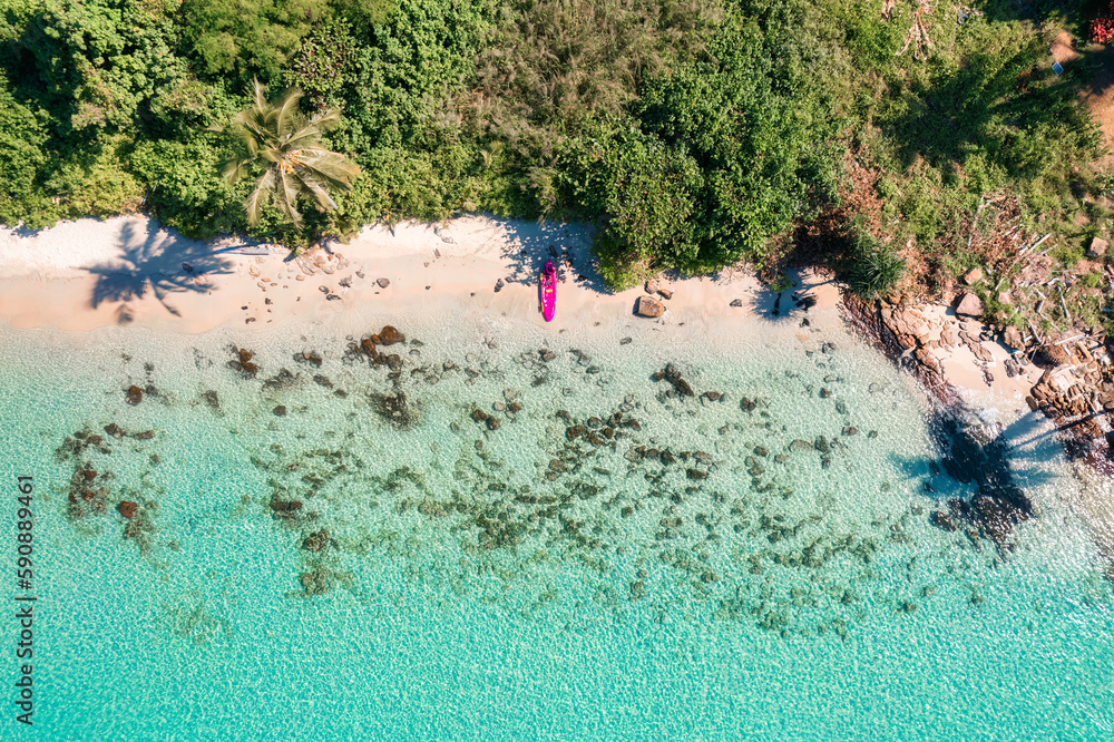 Tropical sea and canoe on the beach in summer