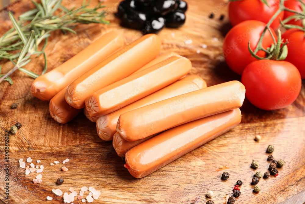 Plate with sausages, tomatoes and olives, closeup