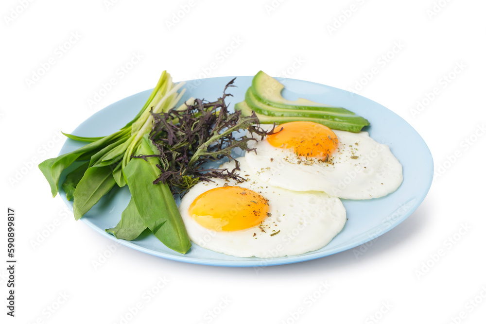 Plate with tasty fried eggs and greens on light background