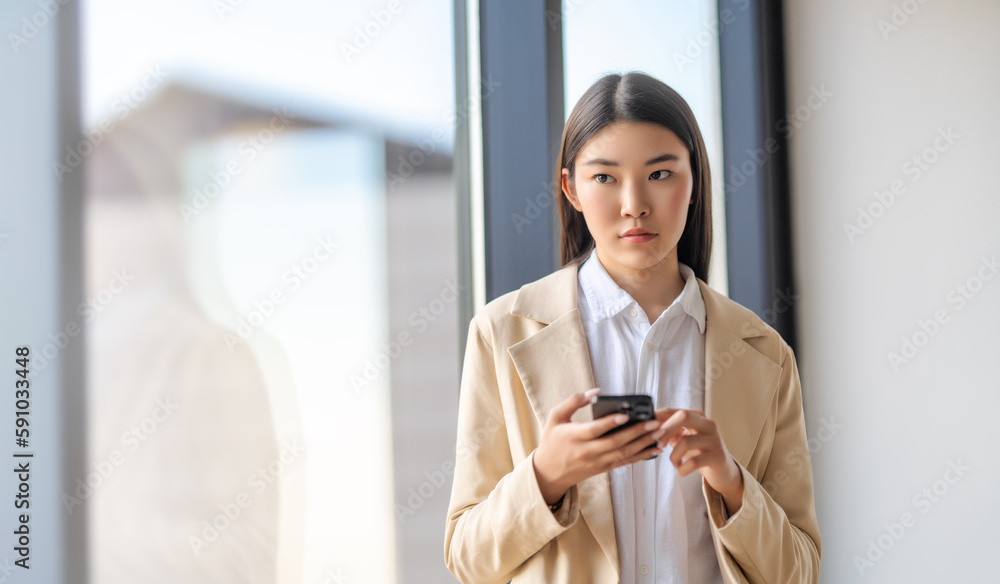 asian woman is using phone