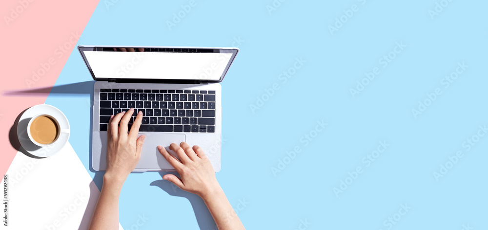 Person using a laptop computer from above