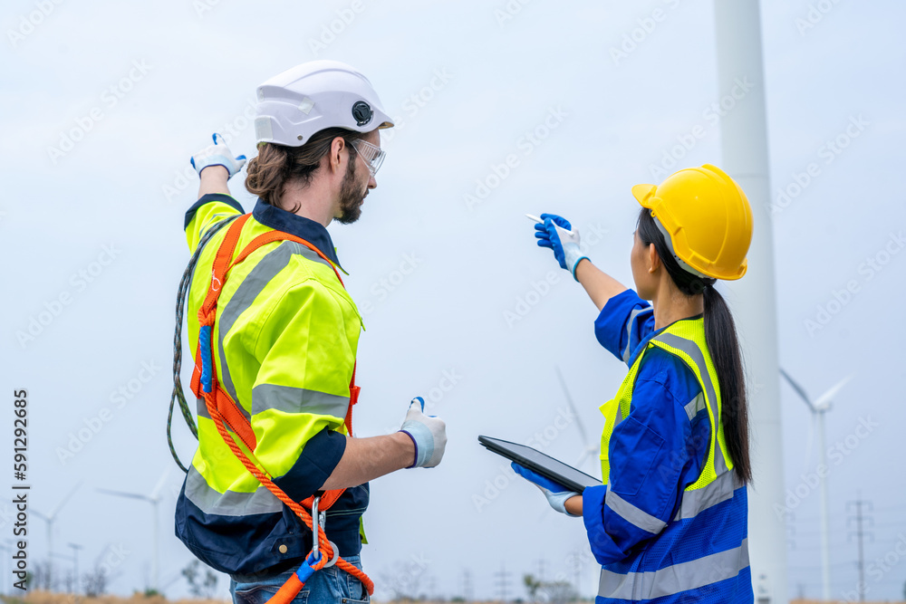 Engineer working and maintenance in wind turbine,Power generation Saving and using renewable energy 