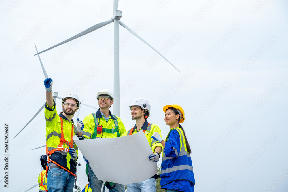 Technician Engineer in uniform are checking wind turbine power farm, Power generator station,Clean e