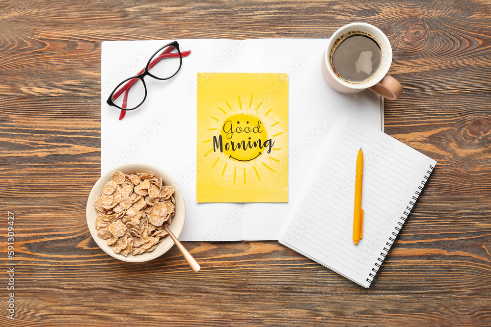 Composition with card, cup of coffee, corn flakes and notebook on wooden background