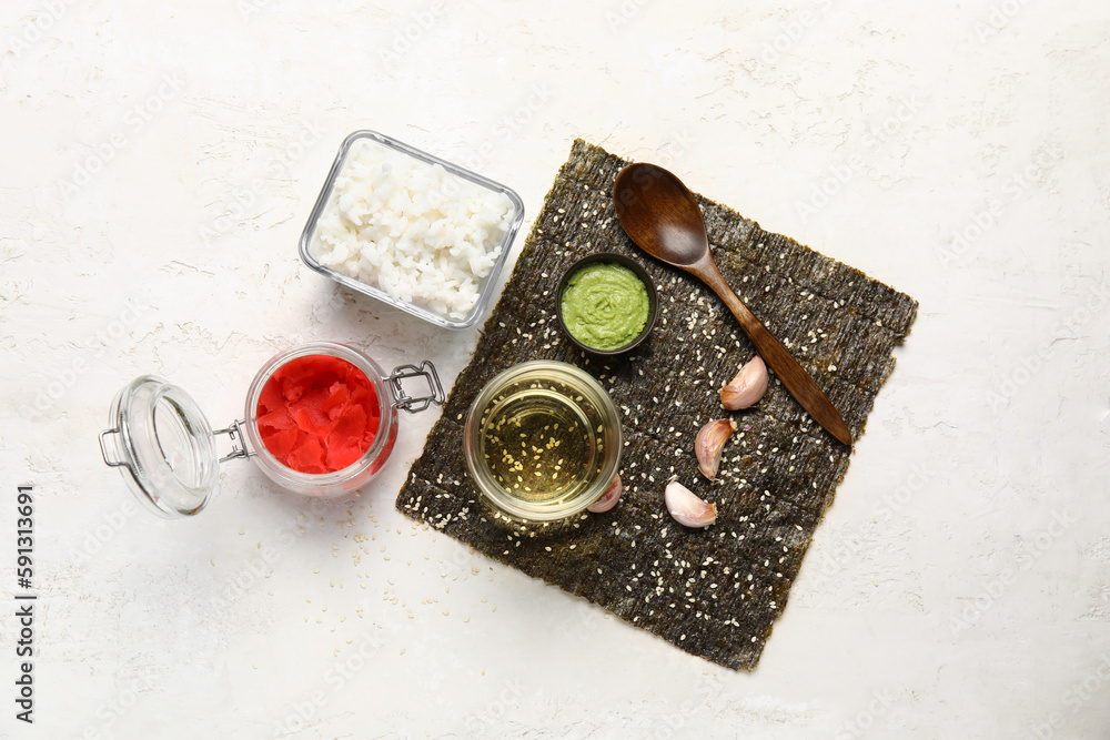 Composition with ingredients for preparing tasty sushi rolls on light background