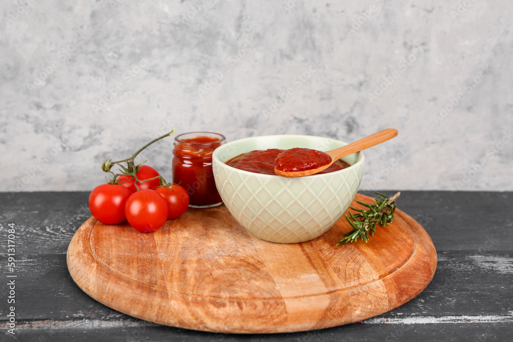 Bowl with tasty tomato paste and fresh vegetables table