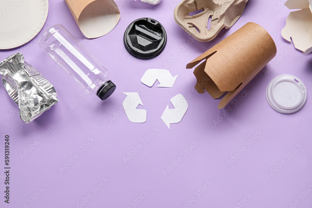 Recycling sign with garbage on lilac background