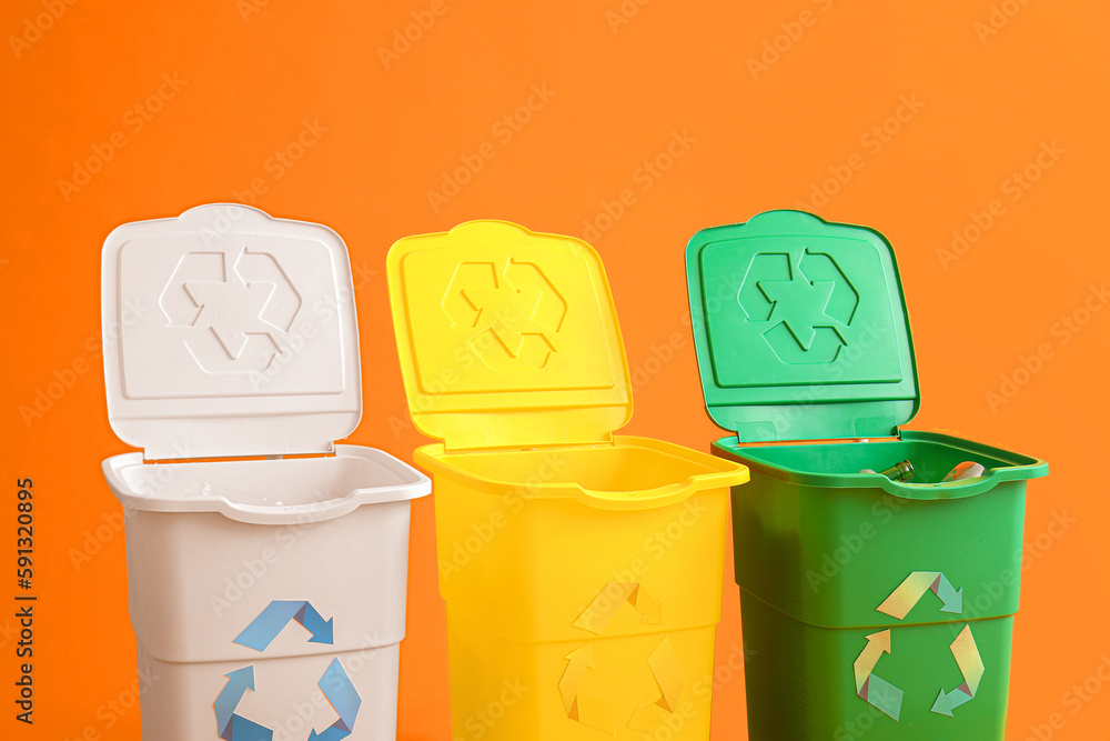 Containers for garbage on yellow background. Recycling concept