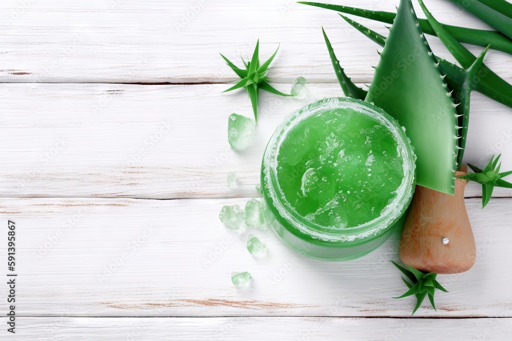  a green drink with aloem and a wooden cutting board on a white wooden table with aloem leaves and a