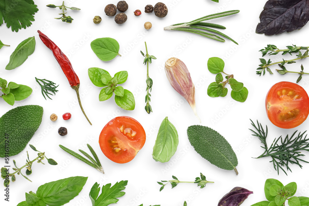 Composition with fresh herbs, spices and tomatoes on white background