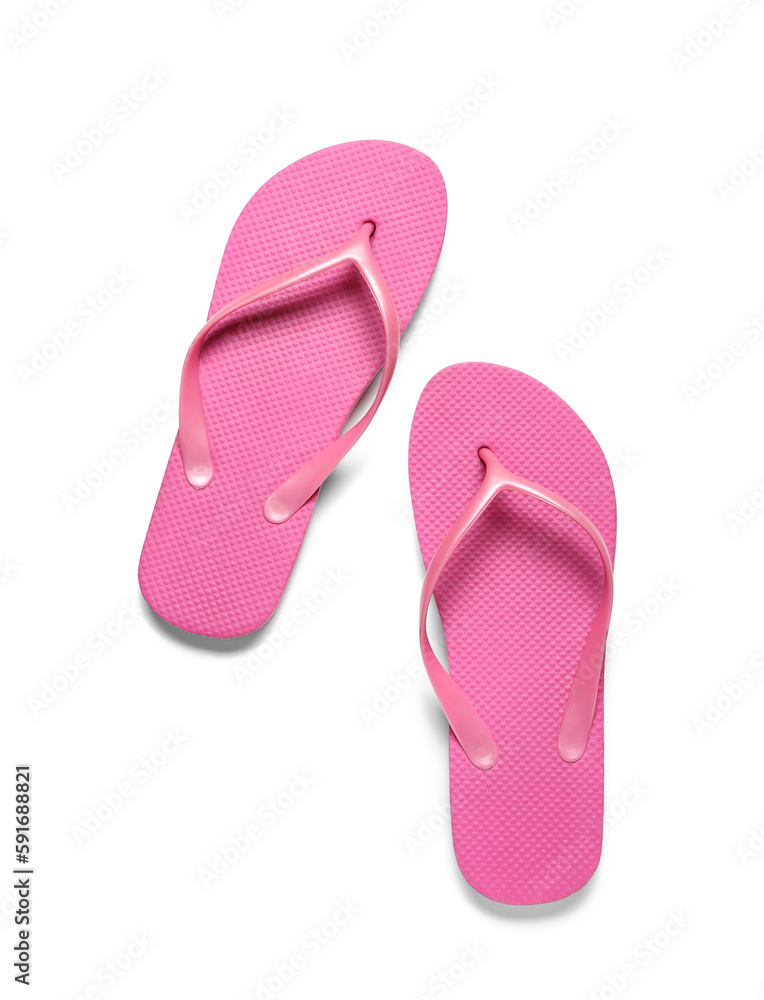 Pair of pink flip-flops on white background