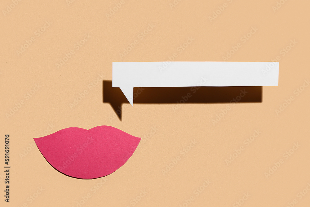 Paper lips with speech bubble on beige background. Dialogue concept