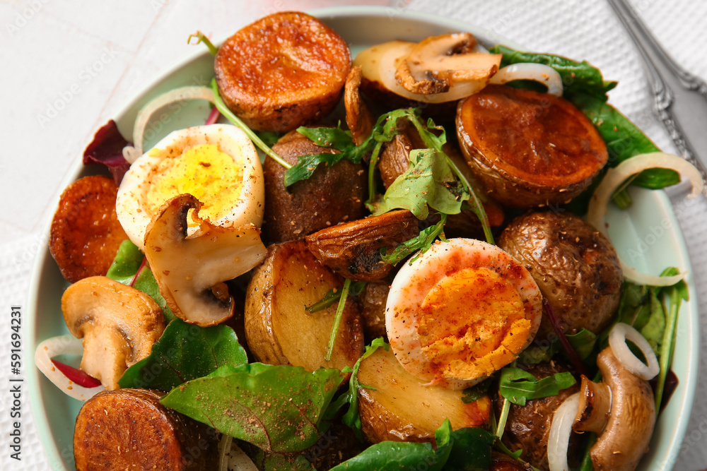 Plate of tasty potato salad with eggs and mushrooms, closeup