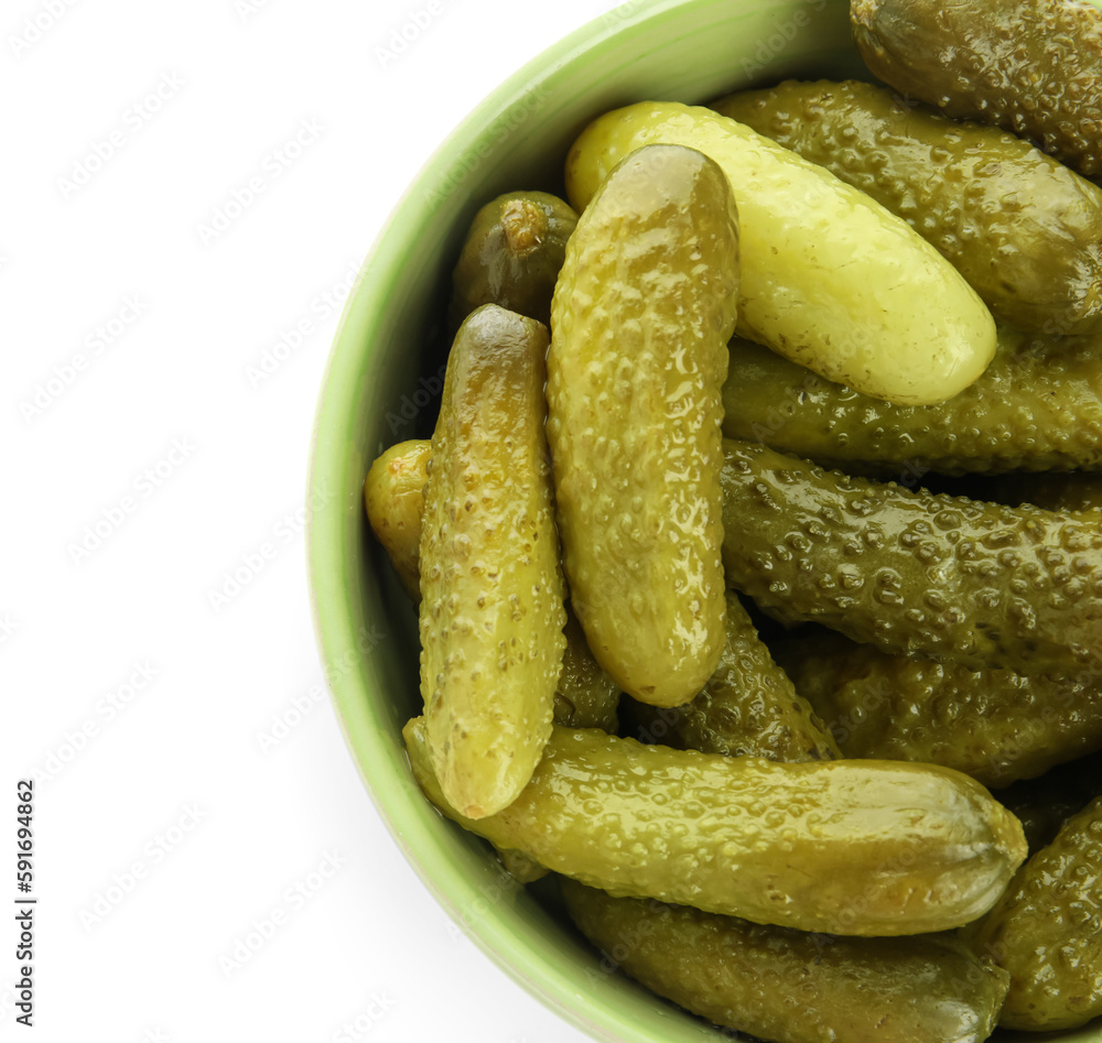 Bowl with tasty fermented cucumbers on white background