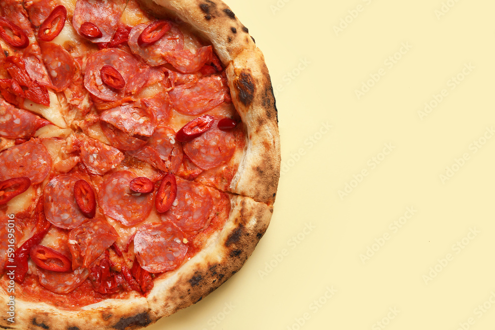 Delicious pepperoni pizza on beige background