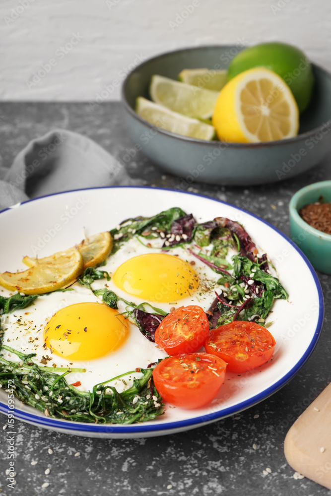 Plate with tasty fried eggs and salad on table