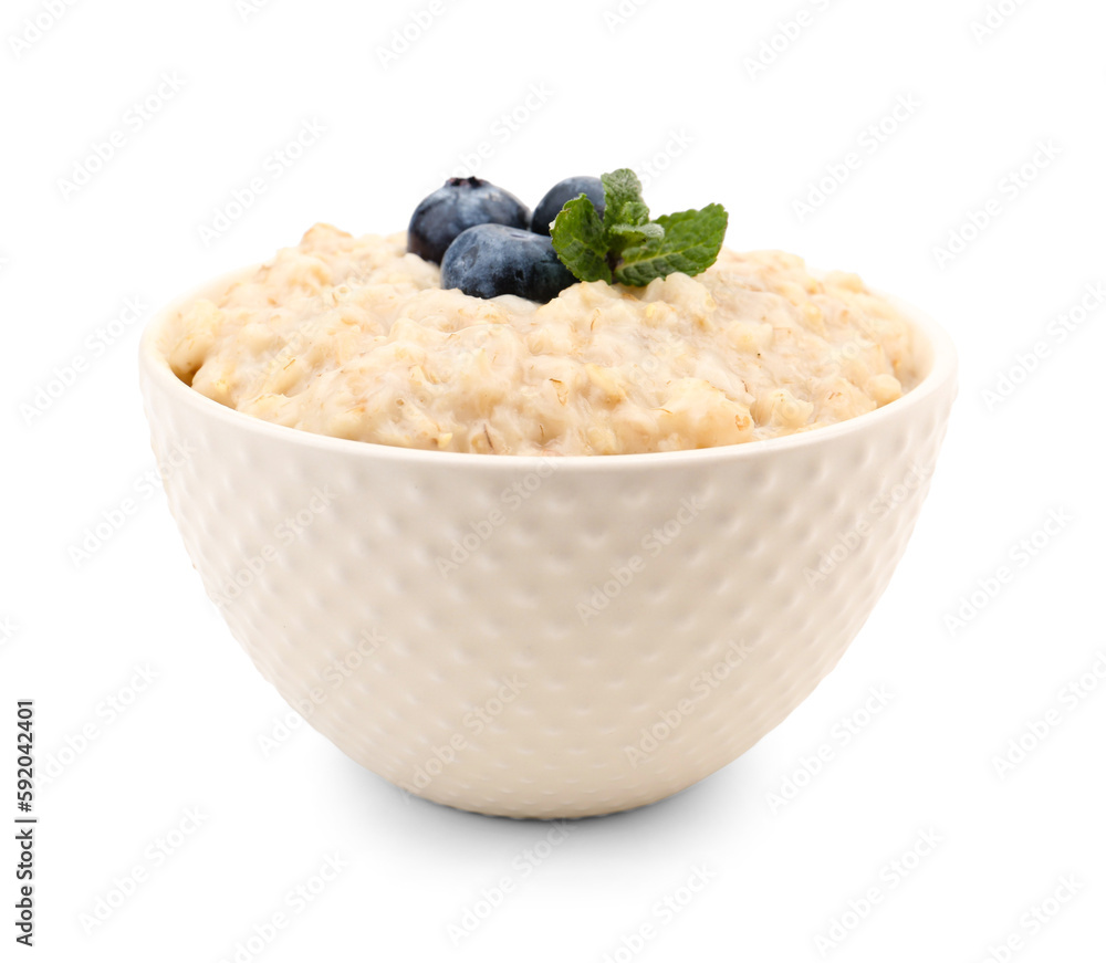 Bowl with tasty oatmeal, blueberries and mint isolated on white background