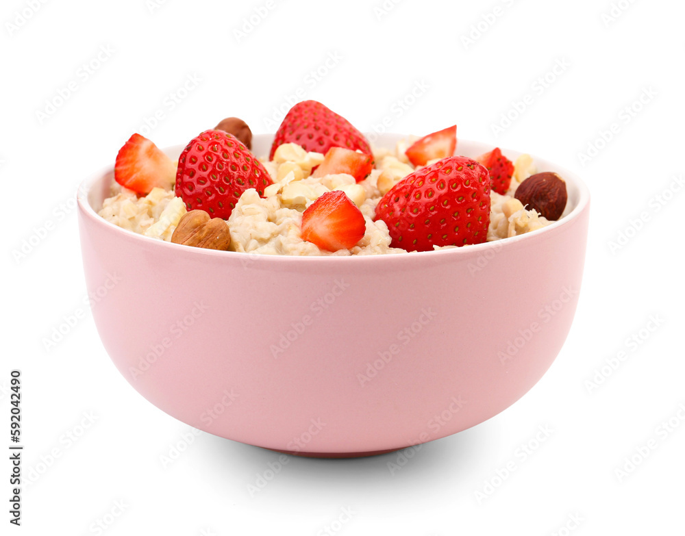 Bowl with tasty oatmeal, hazelnuts and strawberries isolated on white background