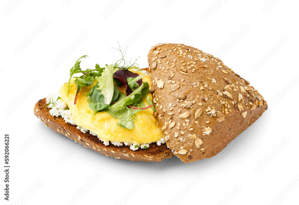 Tasty scrambled eggs sandwich and greens on white background