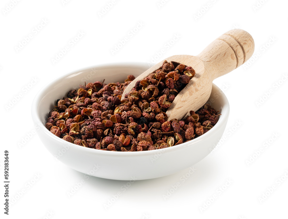 Sichuan pepper in a white bowl set against a white background.