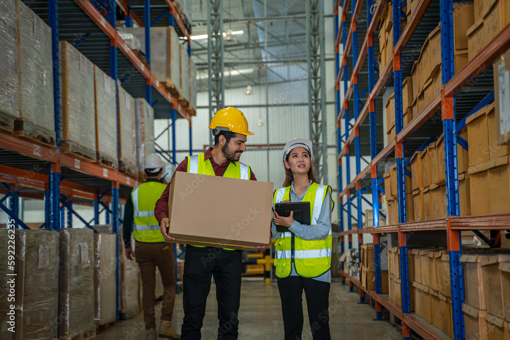 Warehouse worker checking in warehouse,This is a freight transportation and distribution warehouse. 