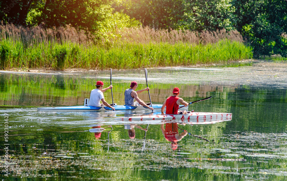 guys floating in a canoe on the rive