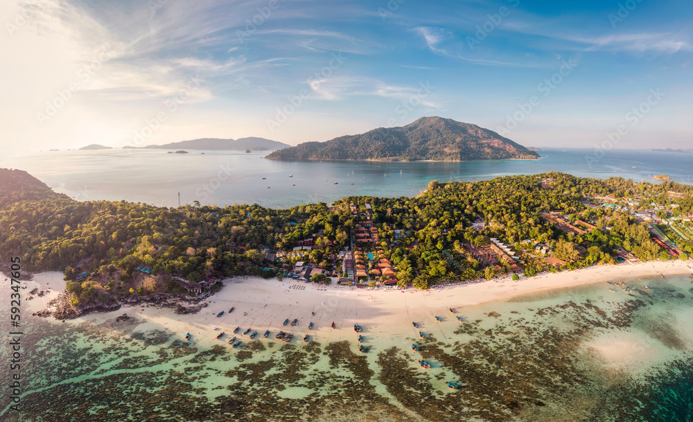 Beautiful Koh lipe island with tropical sea, fishing boat and resort on the beach in summer vacation