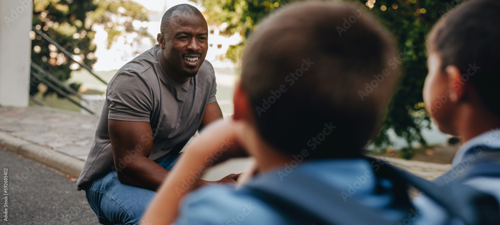 Teacher giving his students a pep talk in elementary school