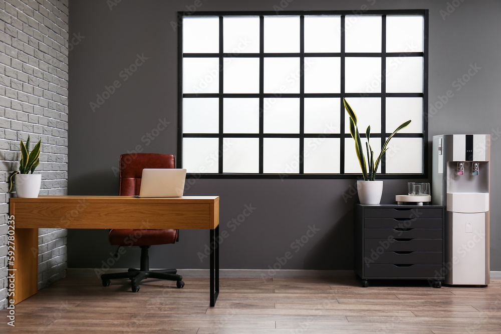 Interior of office room with modern water cooler