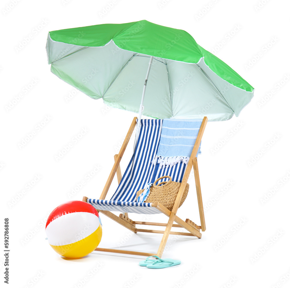 Deck chair, green umbrella and beach accessories isolated on white background