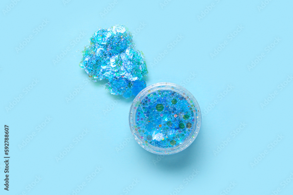 Jar of glitter with stroke on blue background