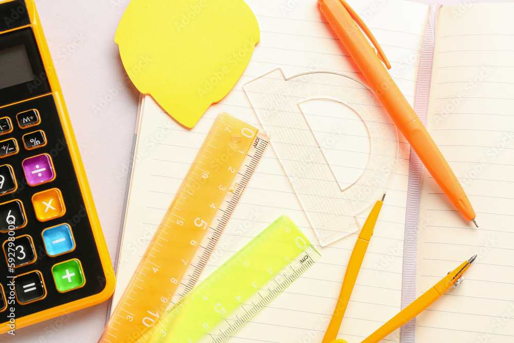 Notebook and stationery supplies on white background